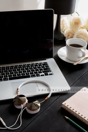 Laptop, Coffee & Headphones on a Black Desk