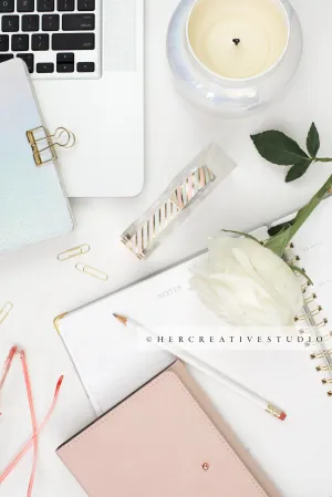 Workspace with Pink Notebook and Candle. Stock Image